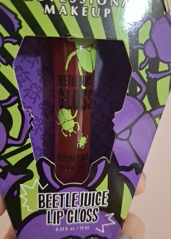 Beden NYX Beetlejuice Pomegrante Clout Gloss