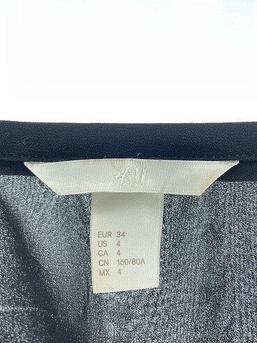 34 Beden siyah Renk H&M Gömlek %70 İndirimli.