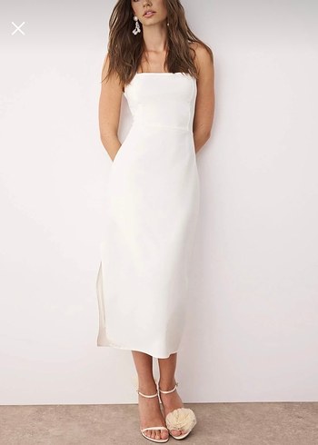 Beyaz Astarlı Vücuda Oturan Yırtmaç
Detaylı Midi Dokuma Elbise - Görsel 2