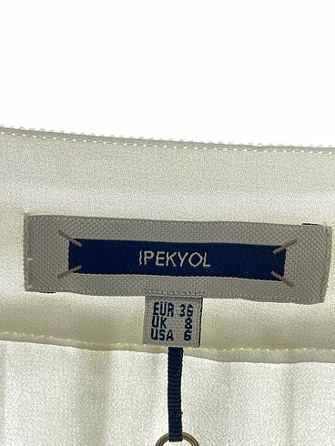 36 Beden beyaz Renk ipekyol Midi Etek %70 İndirimli.