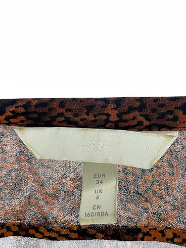 34 Beden kahverengi Renk H&M Uzun Elbise %70 İndirimli.