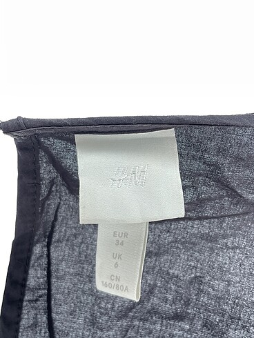 34 Beden siyah Renk H&M Kısa Elbise %70 İndirimli.