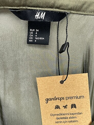 34 Beden haki Renk H&M Kısa Elbise %70 İndirimli.