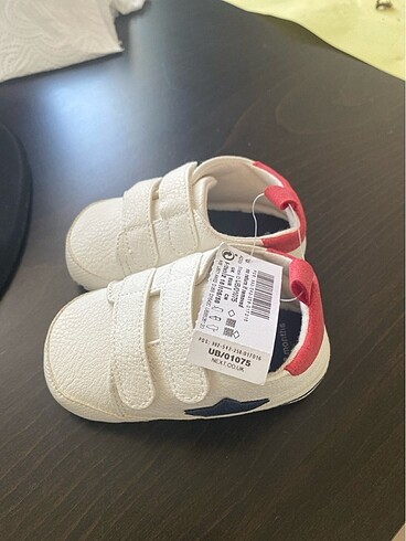 Etiketi uzerinde next baby patik