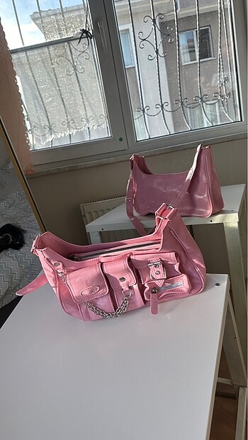 Pembe çok gözlü kol çantası
