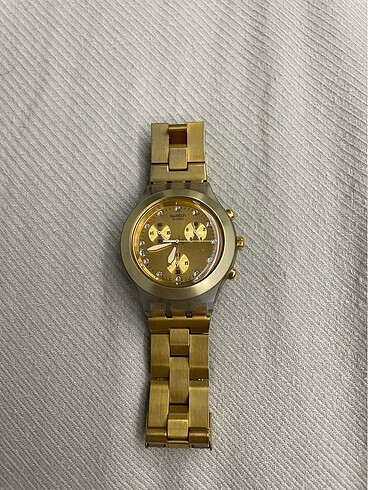 Swatch gold kol saati