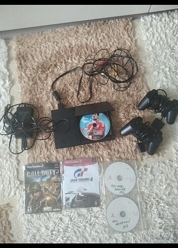 Ps2 + 2 kol + 5 oyun + görüntü kablosu+ adaptör 