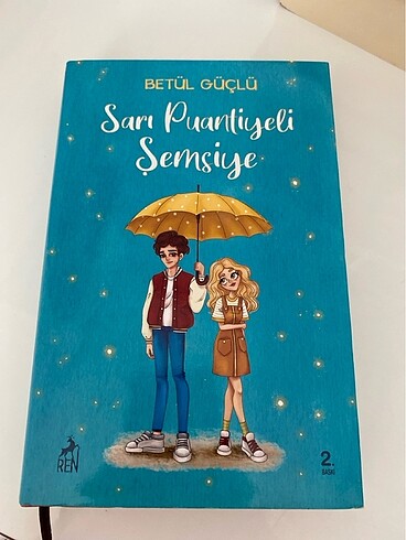 Sarı puantiyeli şemsiye