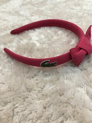 Lacoste taç