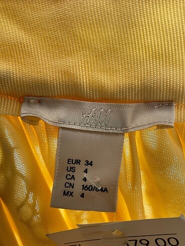 34 Beden sarı Renk H&M Midi Etek %70 İndirimli.