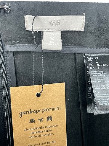38 Beden siyah Renk H&M Midi Etek %70 İndirimli.