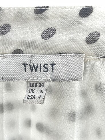 34 Beden beyaz Renk Twist Midi Etek %70 İndirimli.