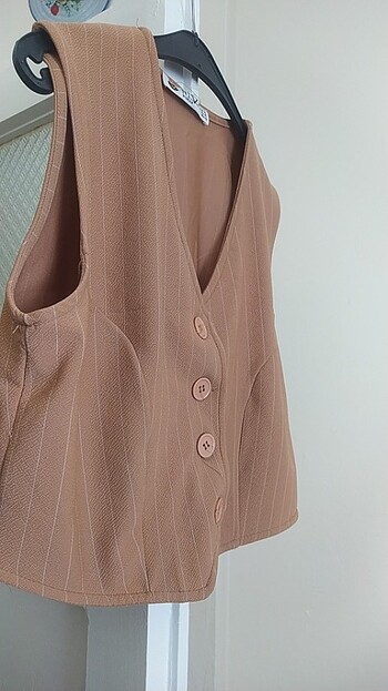 xl Beden Açık kahve yeleğimizin fiyatı sadece 120 TL 