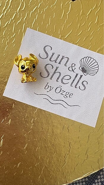 stich gold pandora charm