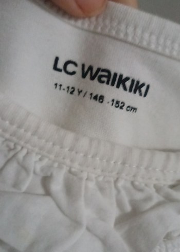 LC Waikiki Kız Çocuk Beyaz Keten Fırfırlı Kolsuz Bluz