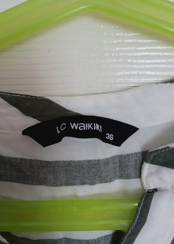 Çizgi düğme detaylı kadın gömlek - Görsel 7