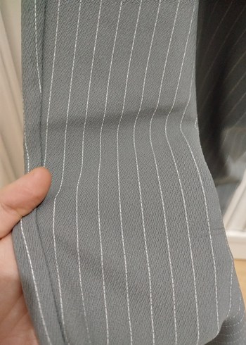 likralıdır yenidir
Gri Çizgili Piliseli Kadın Kumaş Pantolon - Görsel 3