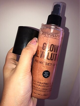 Revolution illuminating face and body spray