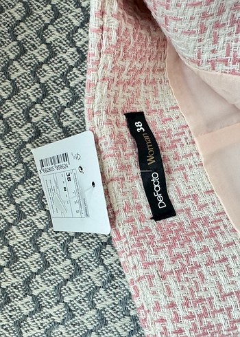 Defacto Pembe ve Gri Dokulu etiketli etek