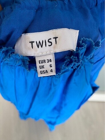 34 Beden mavi Renk Twist fisto detaylı elbise