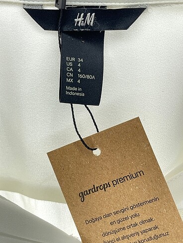 34 Beden beyaz Renk H&M Gömlek %70 İndirimli.