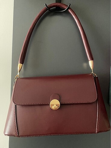 Bordo gold detaylı kol çantası
