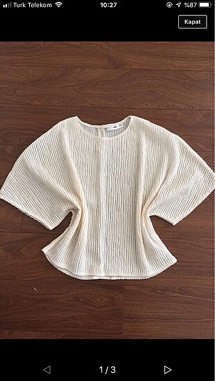 Mango ekru crop bluz