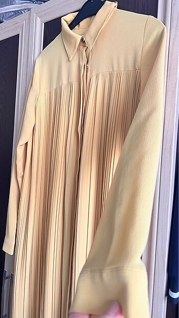 42 Beden sarı Renk 42 beden oversize piliseli krep kumaş tunik. 38/42 beden arası u
