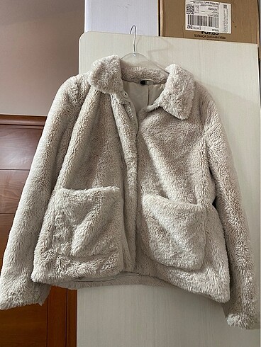 H&M krem rengi suni kürk