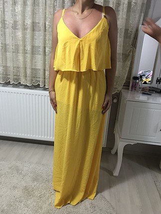 Sarı uzun elbise kullanılmamış ürün tertemiz. 38 beden 