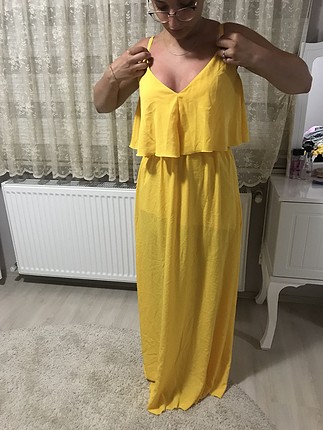 38 Beden Sarı uzun elbise kullanılmamış ürün tertemiz. 38 beden 