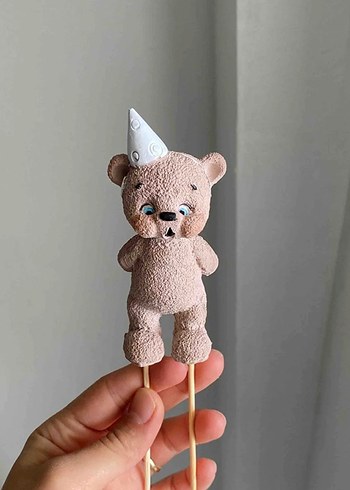 Mum üfleyen ayı - Görsel 2