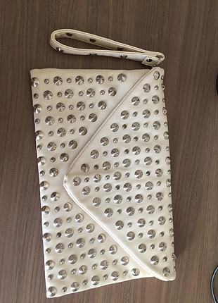 Zımbalı clutch çanta