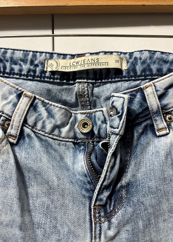 26 Beden Gevşek Kesim Yırtıklı Mavi Denim Kadın Pantolon