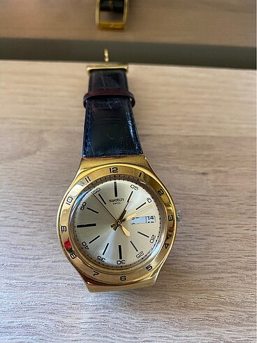 Orjşnal swatch irony altın siyah saat