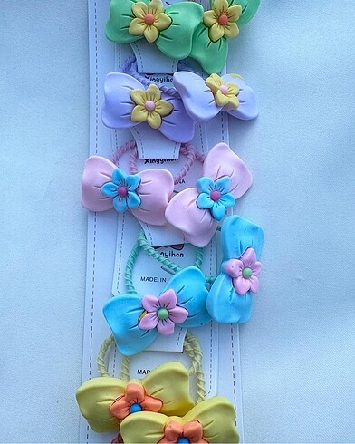 Zara Fiyonk figürlü üzeri çiçek desenli lastik toka