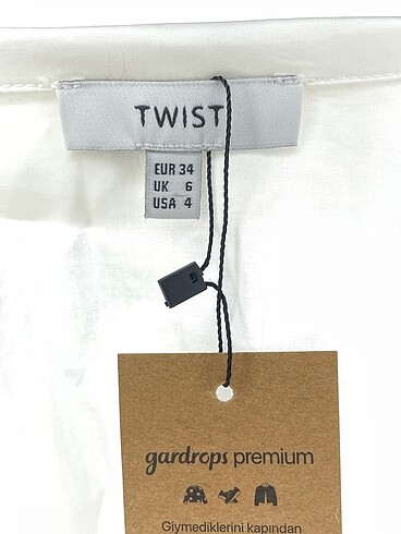 34 Beden beyaz Renk Twist Gömlek %70 İndirimli.