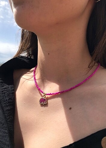Pembe fil detaylı kum boncuk