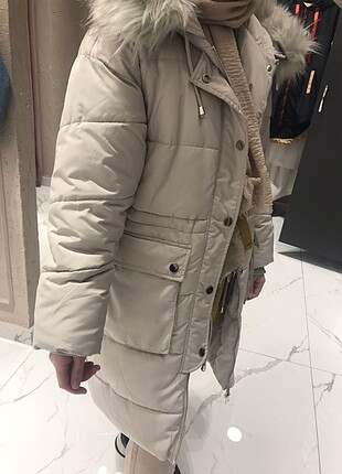 Krem şişme mont