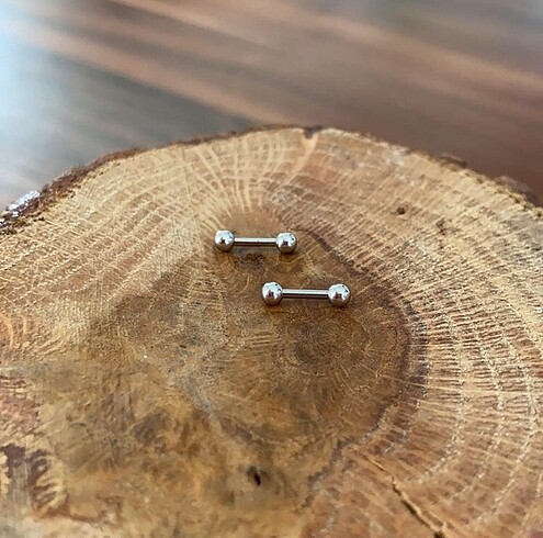 Nipple tragus helix piercing