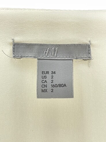 34 Beden beyaz Renk H&M Bluz %70 İndirimli.