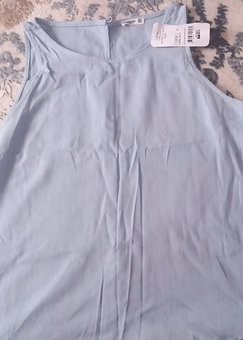 38 Beden V Yaka Mavi Kolsuz Mini Bluz