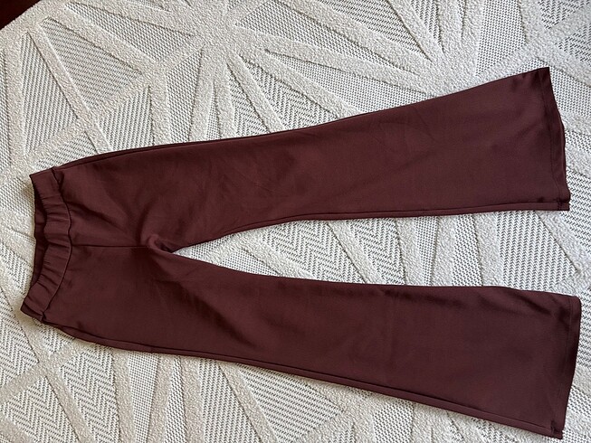 Acı kahve İspanyol paça pantalon dar kalıptır