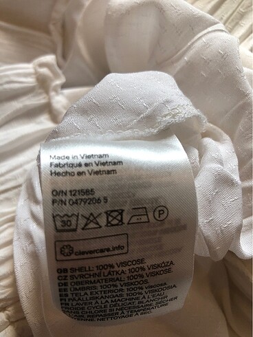 HM kendinden desenli beyaz kayık yakası kalın lastikli yarı uzun - Görsel 6