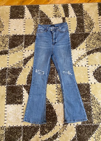 Yüksek bel Flare yırtık jean