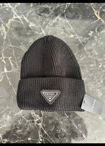 Prada bere