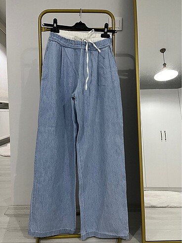 Beli lastikli yüksek bel cepli jean