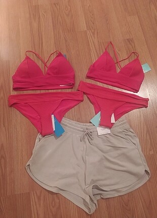 H&M 2 bikini takım ve 1 şort etiketli şekildeler