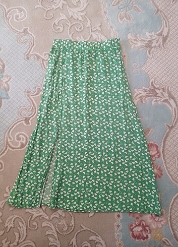 Beli lastikli yırtmaçlı midi etek 