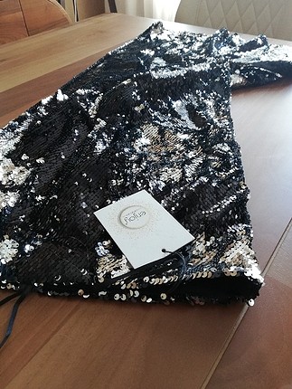 Butik ürünüdür hiç kullanılmadı etiketi üstünde pullu iki renkli